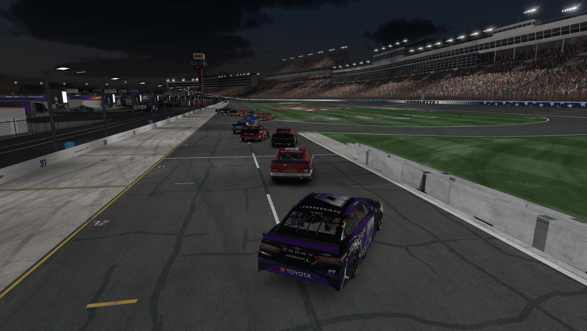 All-Star Race cars lined up on track during a red flag period