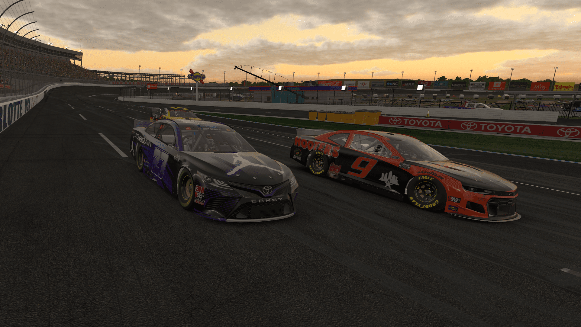 Number 27 racing side by side with another car at Charlotte